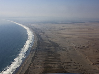 A view of Arica, Chile, at the beginning of a <a href="/people/postcards/vocals/vocals_post.html&edu=elem&dev=1/earth/Atmosphere/moons/triton_atmosphere.html">research campaign to study climate science in the southeastern Pacific</a>. Arica is near the <a href="/earth/atacama_desert.html&edu=elem&dev=1/earth/Atmosphere/moons/triton_atmosphere.html">Atacama Desert</a>, one of the most <a href="/earth/extreme_environments_hot_cold_dry.html&edu=elem&dev=1/earth/Atmosphere/moons/triton_atmosphere.html">arid</a> and barren places on Earth.<p><small><em>Image courtesy of Carlye Calvin, UCAR</em></small></p>
