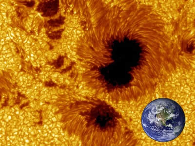Sunspots don't look that big when you see them on the Sun (remember NEVER look directly at the Sun), but in fact they can be enormous!  This composite image shows just how big sunspots can be, to scale with an image of Earth.  Sunspots can be as big, or bigger, than Earth.  The <a href="/sun/activity/sunspot_history.html&edu=elem&dev=1/earth/Atmosphere/moons/triton_atmosphere.html">earliest written record of a sunspot observation</a> was made by Chinese astronomers around 800 B.C.<p><small><em>Image courtesy of Windows to the Universe using images from the Royal Swedish Academy of Sciences (sunspot image) and NASA (Earth image).</em></small></p>